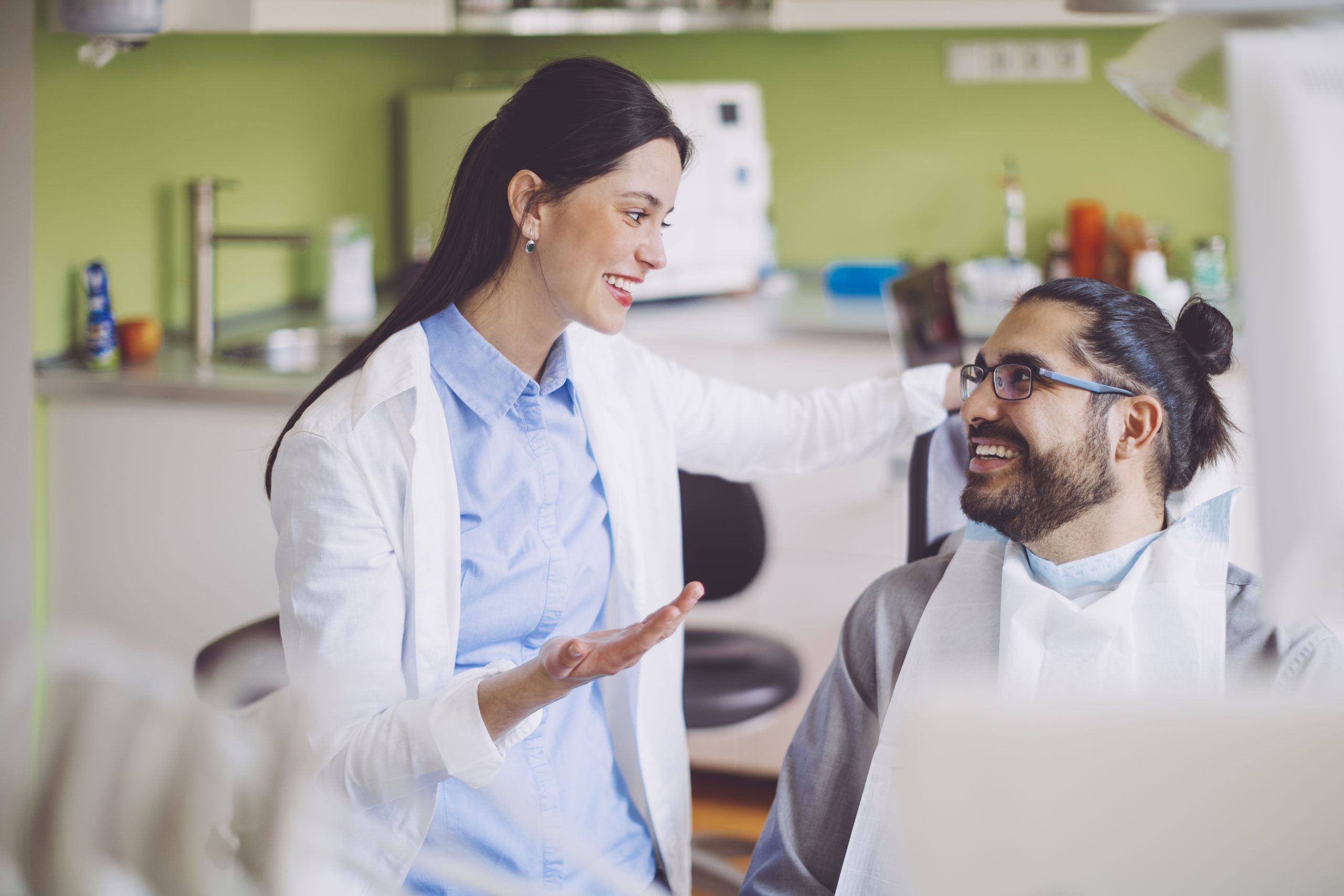 dentist-consulting-her-patient