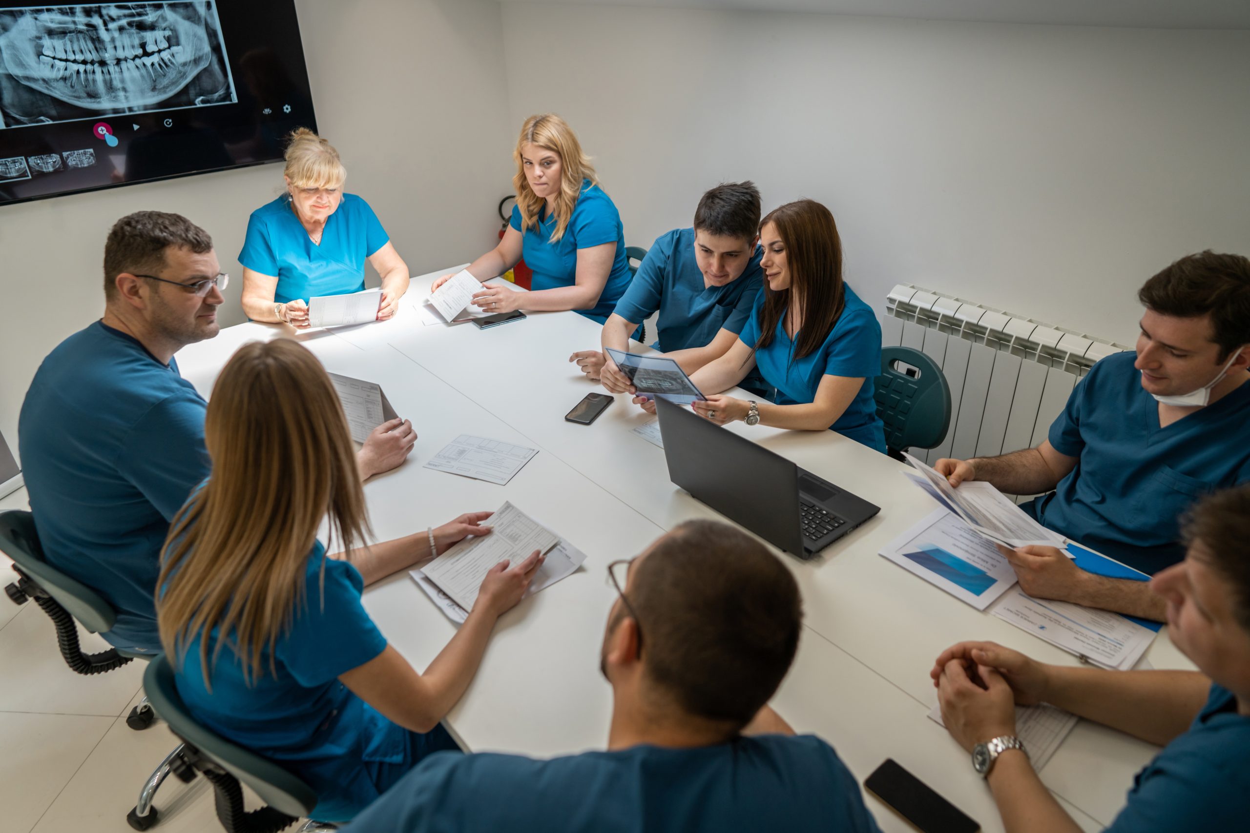 group-of-female-and-male-dentist-having-a-meeting-at-the-office-ad-the-dental-clinic