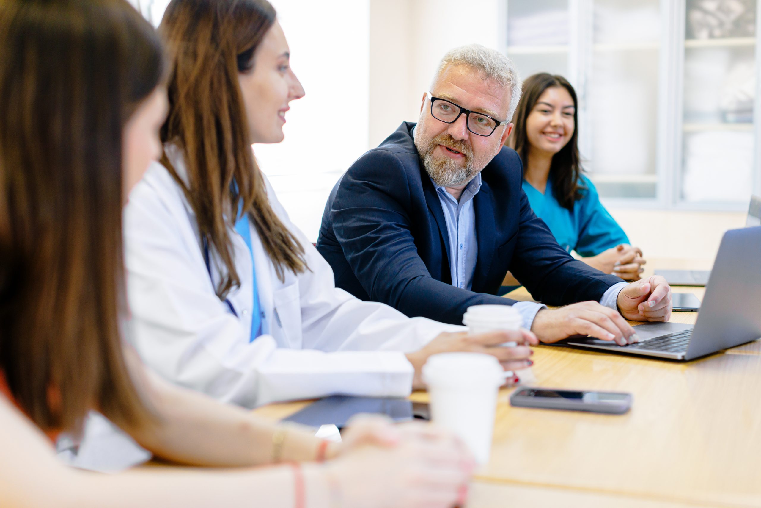 collaborative-excellence-group-of-medical-team-and-business-people-meeting-in-hospital-and-office